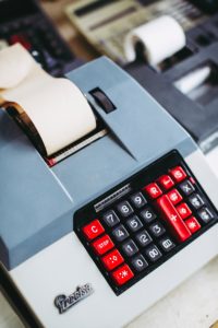 white and red desk calculator